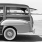 Vintage Woody Station Wagon with Surfboard